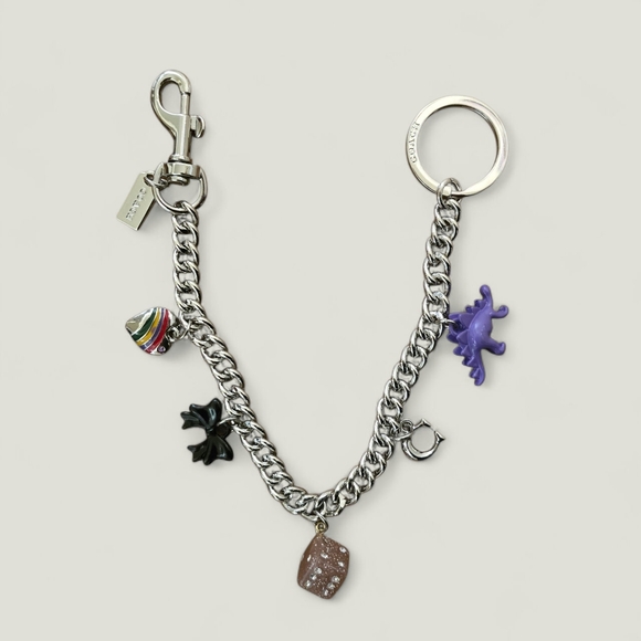 Coach Silver Keychain with Purple Dinosaur and Black Bow - Picture 1 of 5